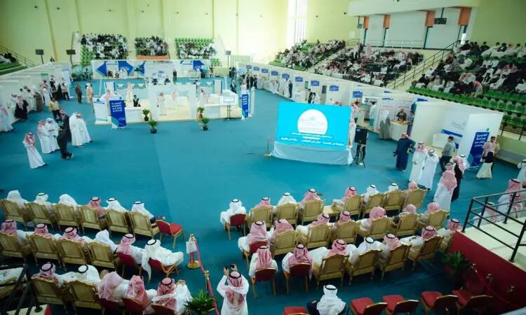 The "My Way to University" exhibition is held in a large, enclosed hall, where a large contingent of visitors arrive wearing the Saudi Ghutra or Saudi Shemagh with mold, and some presenters adorn the Saudi Bisht in all its formal simplicity. The hall is lined with pavilions that encompasses the various desires of the students. In this hall, with large digital displays in the center, visitors are seated at the expected levels in the active events organized by Al-Qassim University.