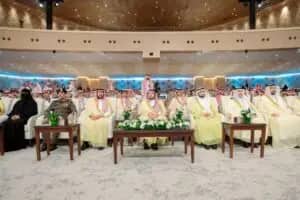 The Emir of Qassim, accompanied by a group of men and a lady in the Saudi Shemagh and cultural celebrations, attended the International Scientific Camel Event at the Al-Zeenah Hall with flowers. They especially joined the Lyricians and the audience dressed in basic Saudi attire, primarily respecting the scientific status of the University of Qassim.