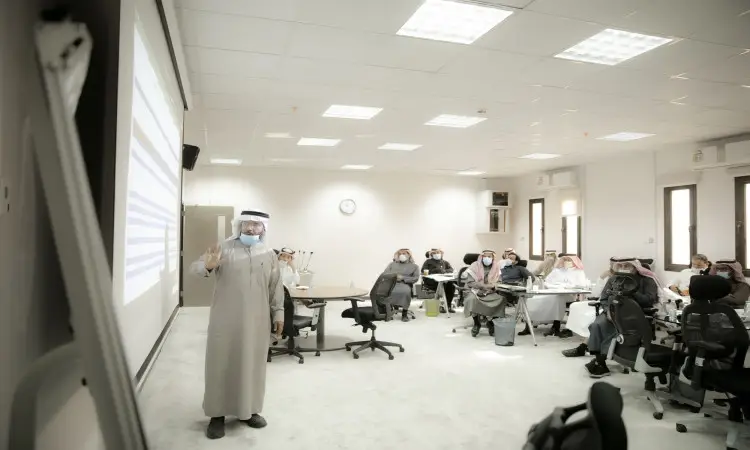 The communication man, dressed in a Saudi-style bisht, aghtara and headband, in the brightly lit, modern auditorium of Shabab, the star-studded team of leadership and events, as the audience - all wearing aghtara or shemagh and headband - listens with quantitative interest to the presentation, even within the confines of Qassim University.
