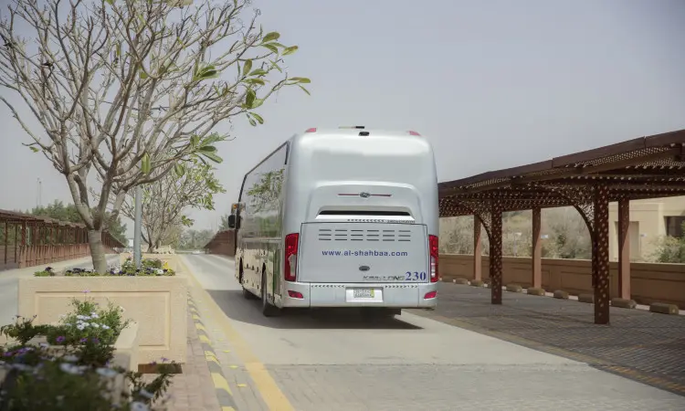 A silver bus, belonging to the Qassim Special Age Lines and the families of the departing martyrs, continues on a road lined with lanes in the desert and shaded by manicured planting beds in a desert setting. It appears at www.al-shhabaa.com. As a result, some passengers were registered, and the official dress with shemagh or ghutra, headband and Saudi bisht disappeared, in 2011, emphasizing the national commitment to the proper appearance of university affiliates.