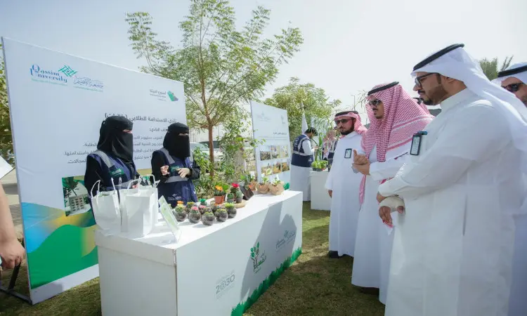 A number of men, sporting the Saudi origin of the Ghutra, Shemagh, Egal and Bisht, gathered around separate outdoor display tables supporting green products, as part of the "Qassim Green Earth Campaign" event organized by Qassim University to promote the concept of sustainability. To prepare awareness posters and information about the event and its objectives.