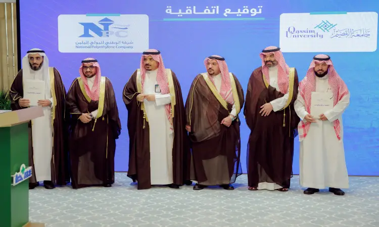 Men wrapped in the Saudi Ghutra or Shemagh with the Saudi Aqal and Bisht are the first to touch the Testers as they confirm documents, and behind them print the logos of Qassim University and the National Polyethylene Company, during the signing ceremony of the cooperation between the university and their partners, in the presence of six His Highness the Emir of Qassim Province.