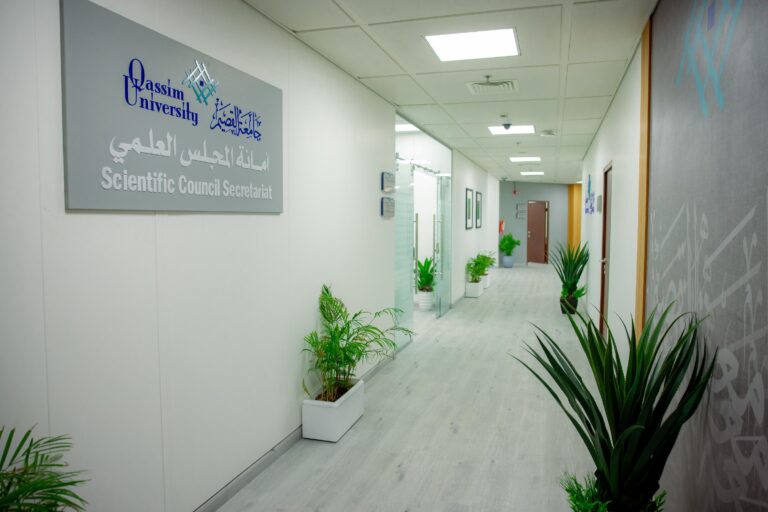 A corridor at Qassim University's Scientific Council Secretariat building reflects an official Saudi academy.