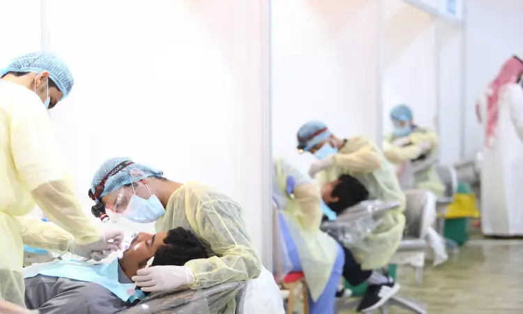 At the Falcons Mindset Dental Center, dentists are dressed in their formal attire, seen wearing the Saudi Ghutra or Shemagh with the Saudi Aqal and Bisht while examining patients' teeth. Raising awareness of the importance of oral health in a multidisciplinary treatment environment for a large number of patients receiving care at the same time is part of Qassim University's approach to excellence in the delivery of its medical services.