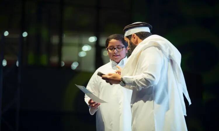 Two people wearing Saudi uniforms, one wearing a Saudi shemagh and an aqal, while the other wears a Saudi ghutra and a Saudi besht, inside a summer club at Qassim University. Differences shift. Some focus on specific hand formations, while others gesture with their hands during the modern era. We strive to achieve specific goals.