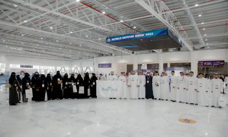 A large number of men in old Saudi Arabia gathered in a modern exhibition hall in Riyadh, where men wore the Saudi ghutra or shemagh, aqqal and bisht, while a group of Qassim University students and certificates were among the attendees. The exhibition is titled "Global Defense Exhibition 2022."