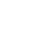 A simple white symbol showing a city skyline consisting of four buildings: A house, a cracked anthropomorphic skyscraper with windows, a high-rise building with a henge roof, as well as a smaller block-shaped building.