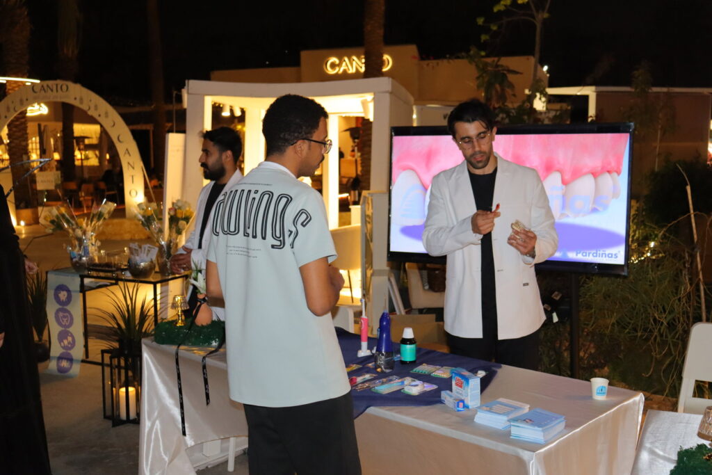 Health awareness at Qassim University in an academic event, with demonstrations and dental models.