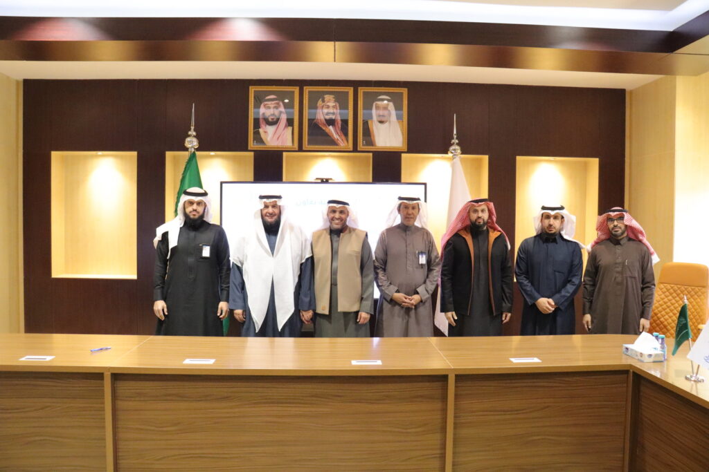 Cooperation agreement between Qassim University and Saudi health institutions in an official hall.