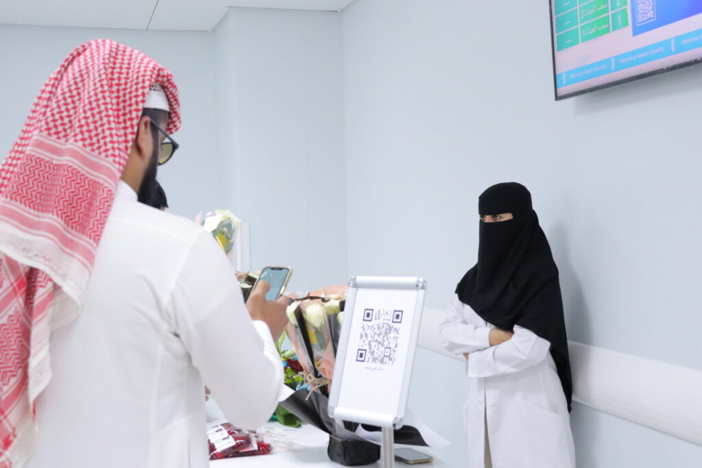 A health awareness event at Qassim University with the presentation of health programs and services and the interaction of visitors.