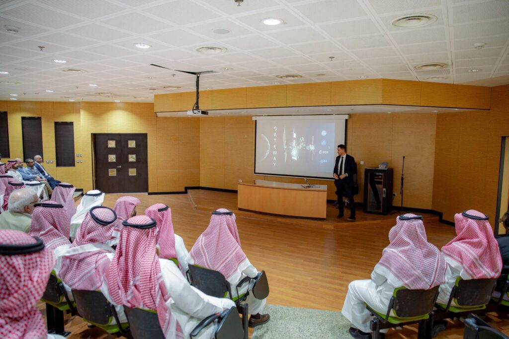 A presentation on World Space Week at a conference hall at Qassim University.