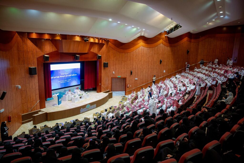 A large hall at Qassim University hosts an exhibition of worlds with an academic presence amid a distinctive scientific atmosphere.