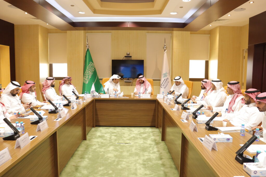 An official meeting at Qassim University to discuss current collaborations between Saudi health institutions.