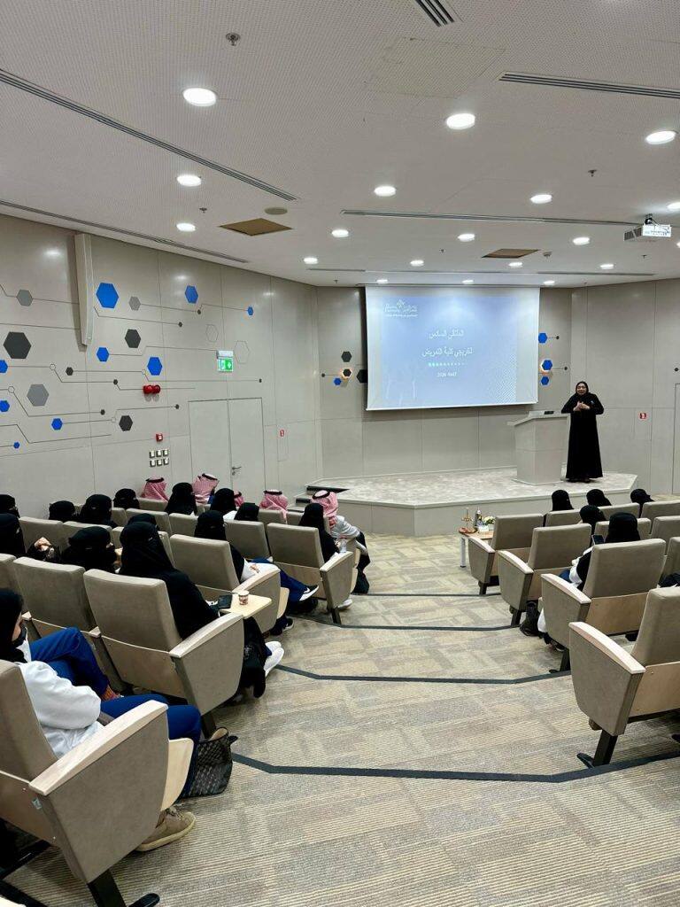 An academic presentation about the college's graduates at the annual forum at Qassim University.