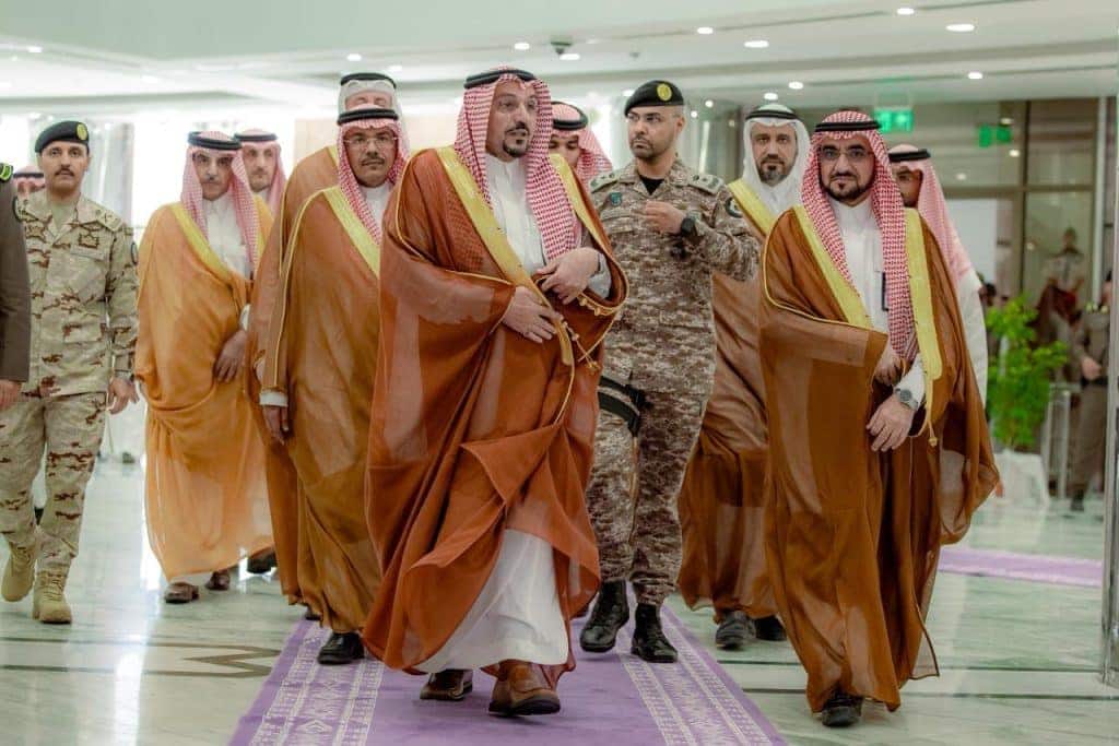 An official participates in the national forum at Qassim University to discuss crowd management in organizations.