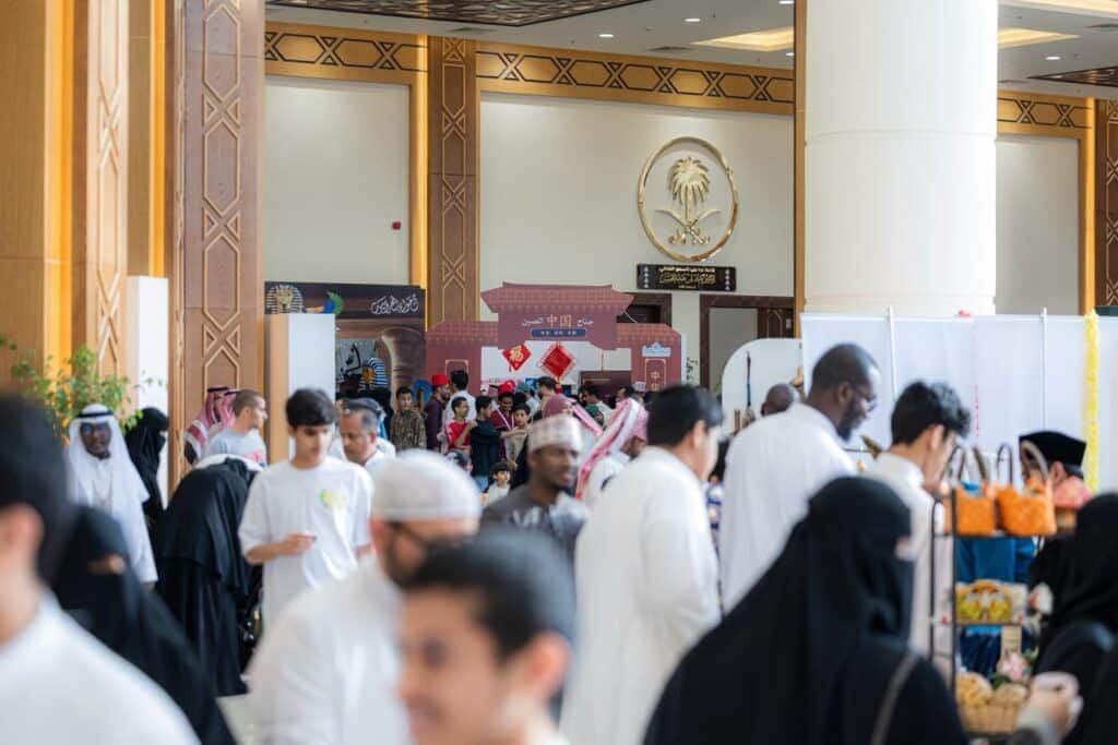 A cultural event at Qassim University showcases peoples in an authentic community atmosphere.