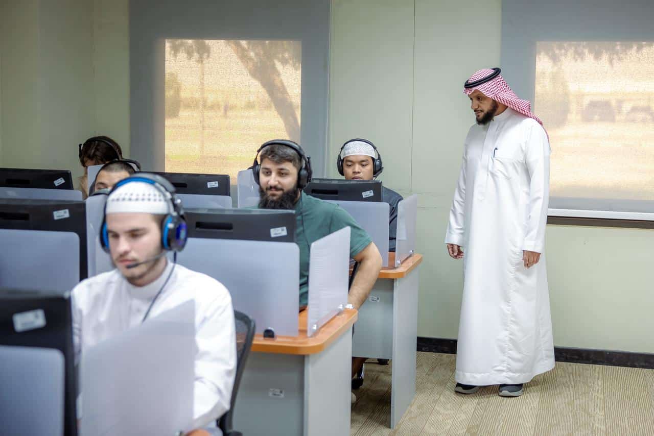 Students taking electronic exams in a laboratory at Qassim University as part of a Saudi academy.