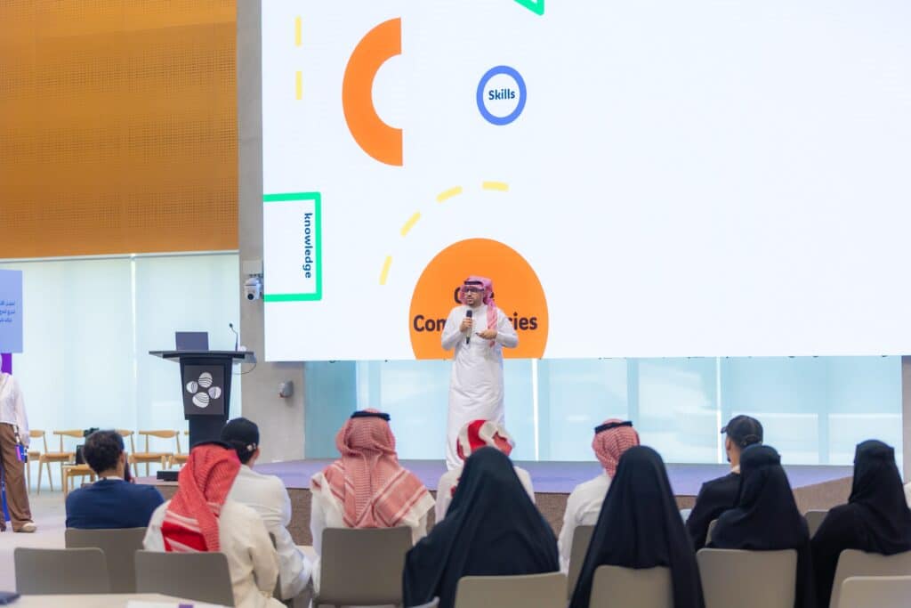 Academic seminar at Qassim University on skills, innovation, and training camps.