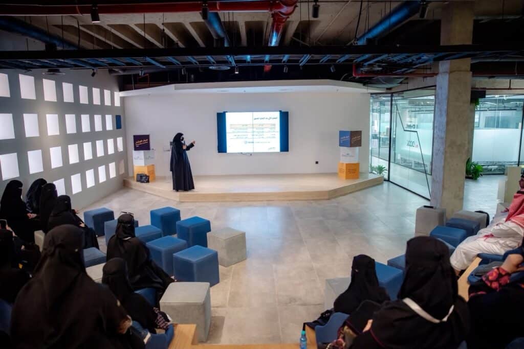 Educational presentation on the «Innovation Summer 2026» program at Qassim University's modern hall.