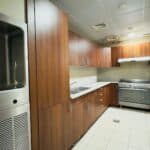 A university kitchen in one of Qassim University's student housing buildings, fully equipped to serve students.