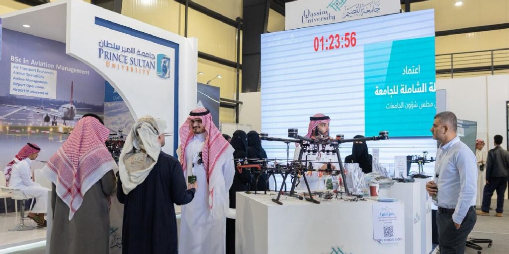 Qassim University's booth at the General Aviation Exhibition showcases drone technologies with an academic presence.